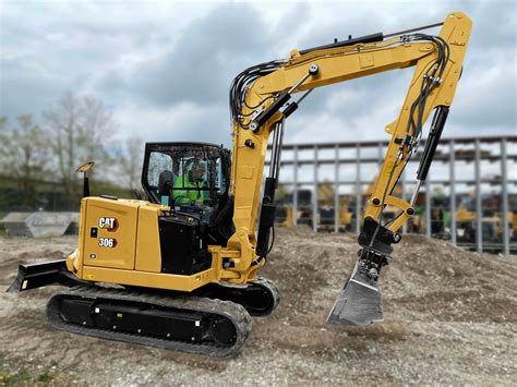 cat mini excavator with skid steer bucket|cat 306 mini excavator.